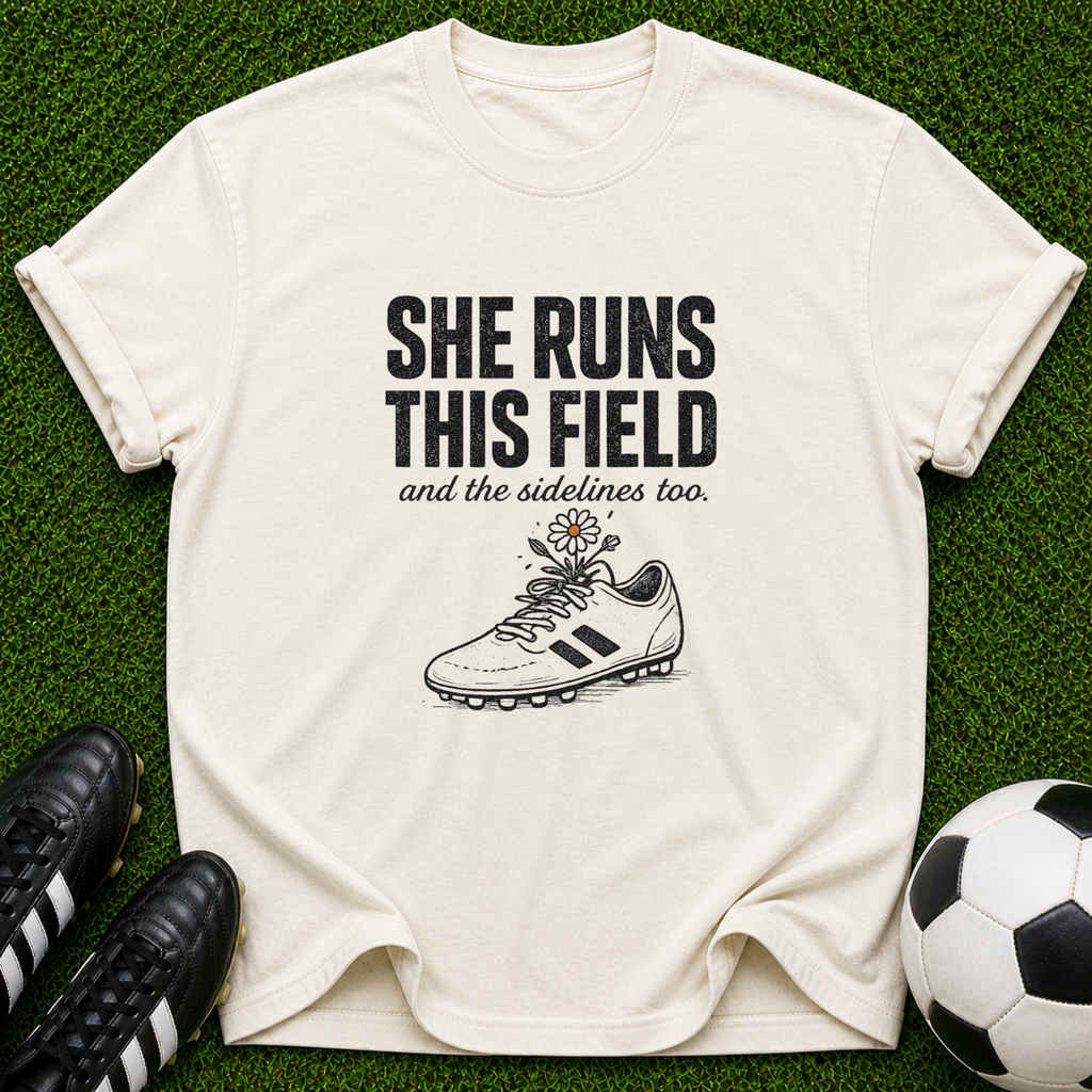 She Runs This Field soccer cleat T-shirt